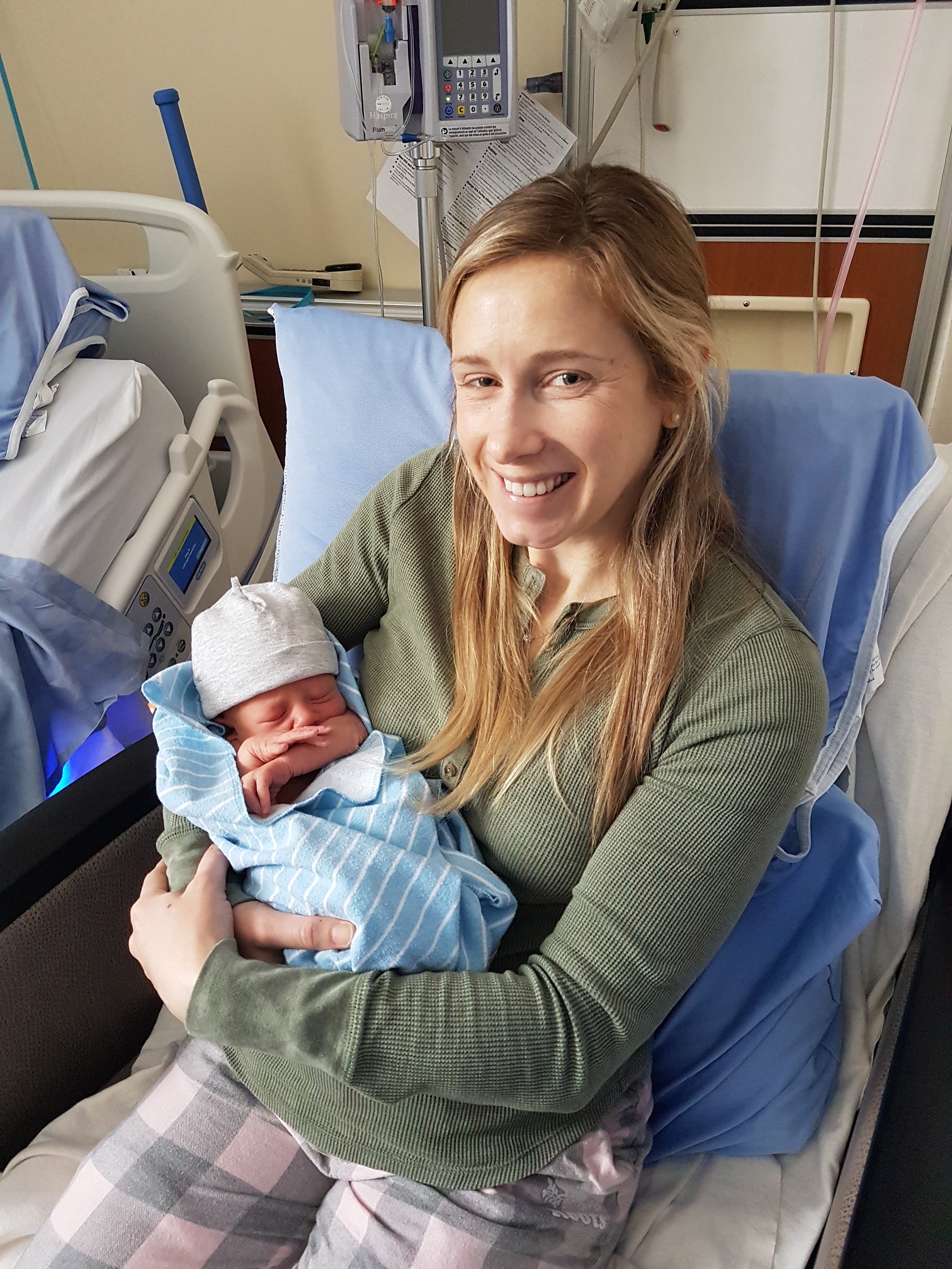 Woman holding newborn baby