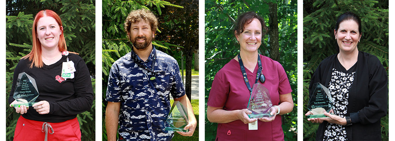 Four Board Award of Excellence recipients with awards