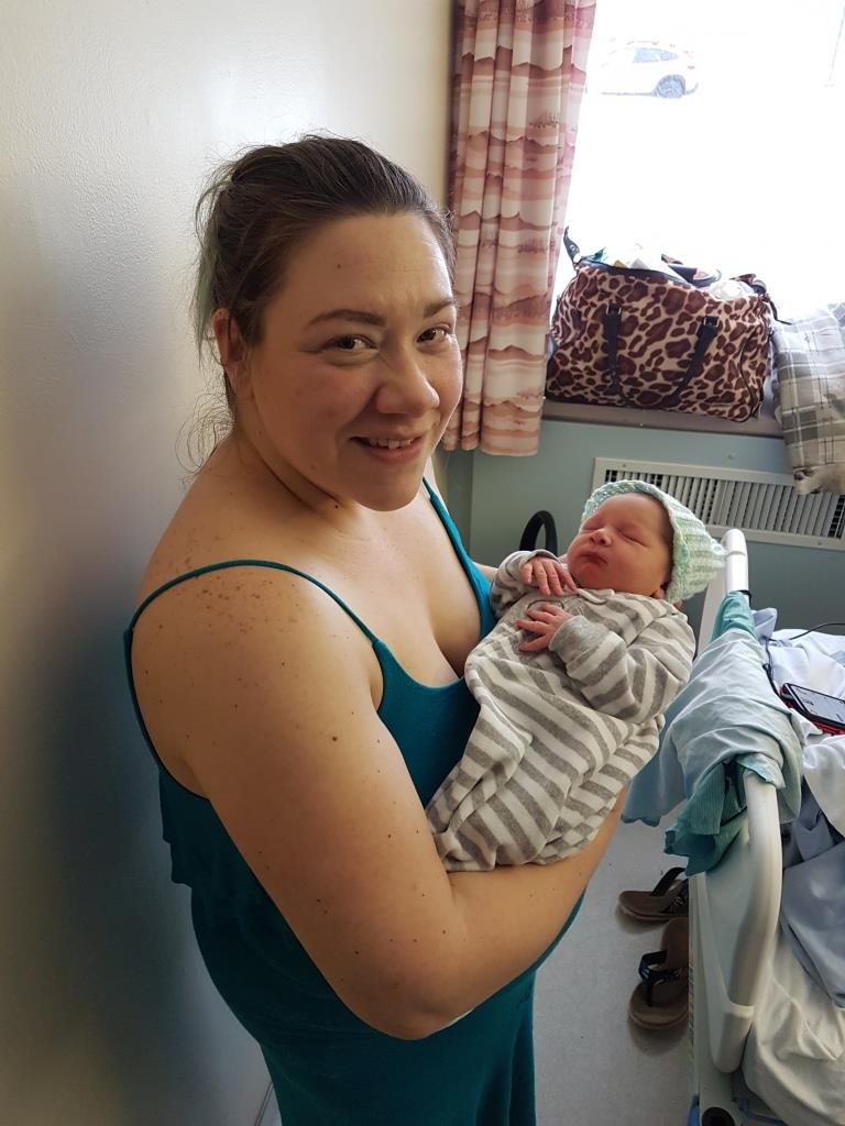 Woman holding newborn baby