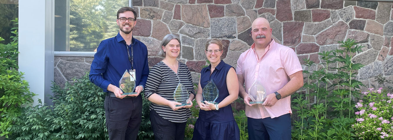 Four recipients of the Board Award of Excellence