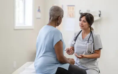 Physician talking to patient